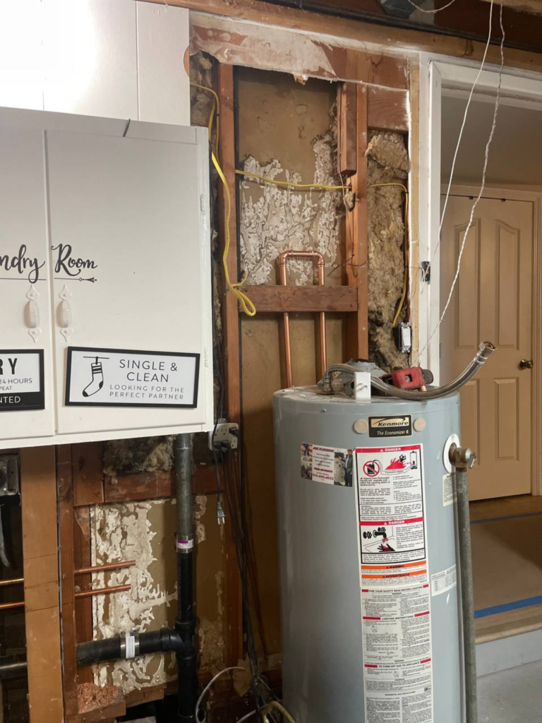 The water heater has been removed from the laundry room.