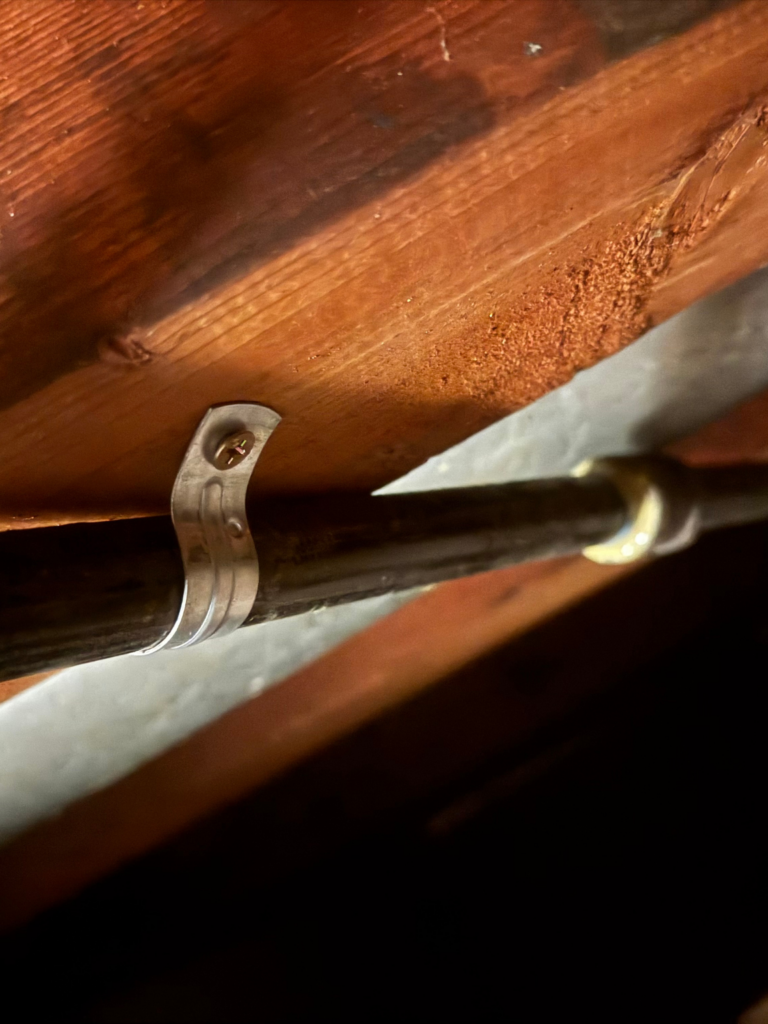 gas pipe mounting under the floor