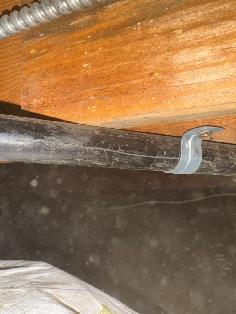 Sewer line mounting under the floor