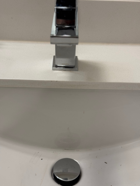 square faucet in a white sink