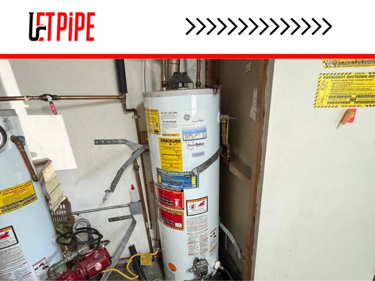 Old undersized Kenmore water heater in unfinished utility room of Bay Area home