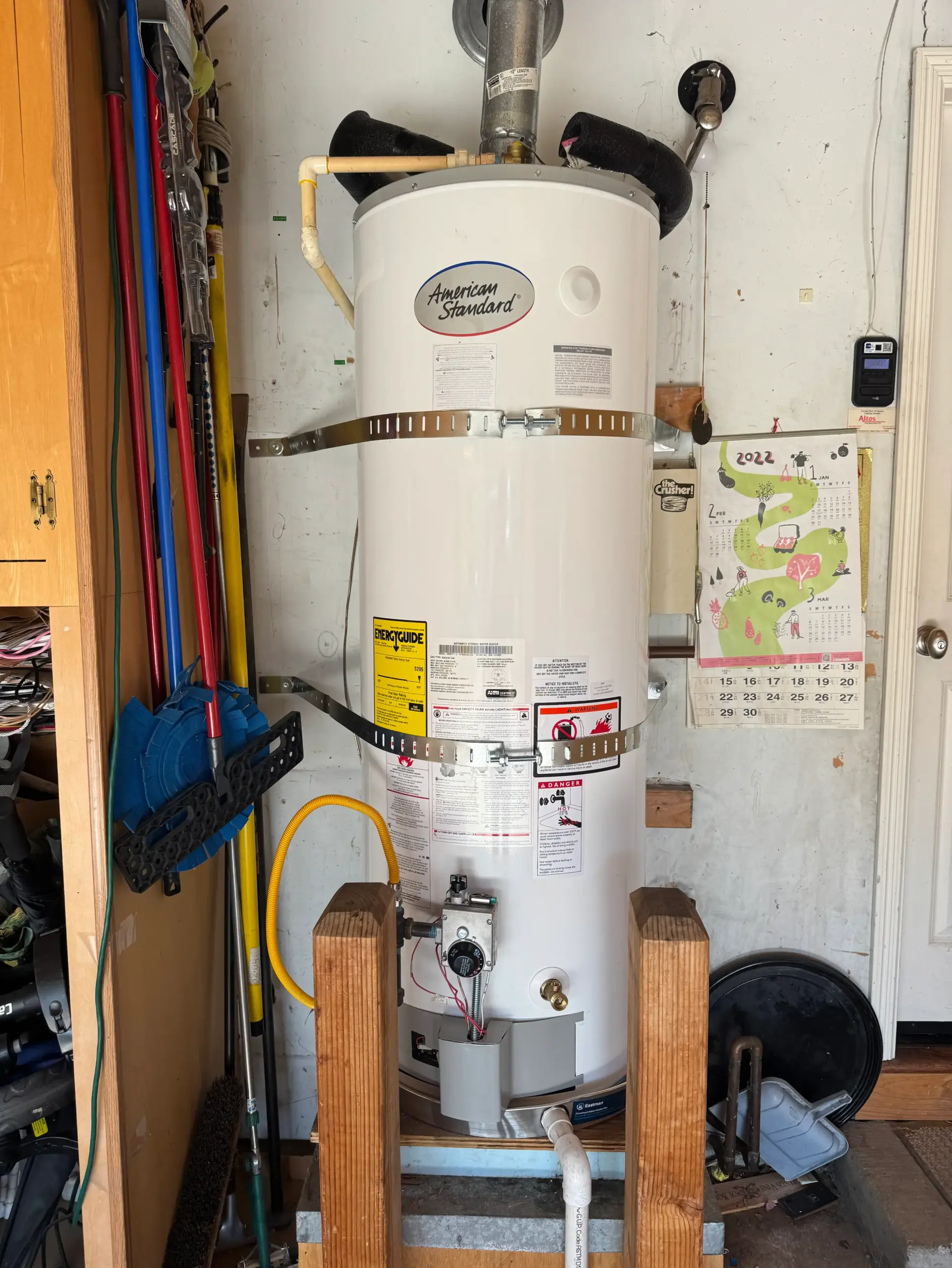 American 50 gallon water heater installed in a utility area
