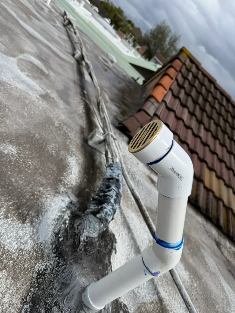 PVC furnace vent piping replaced in a utility area
