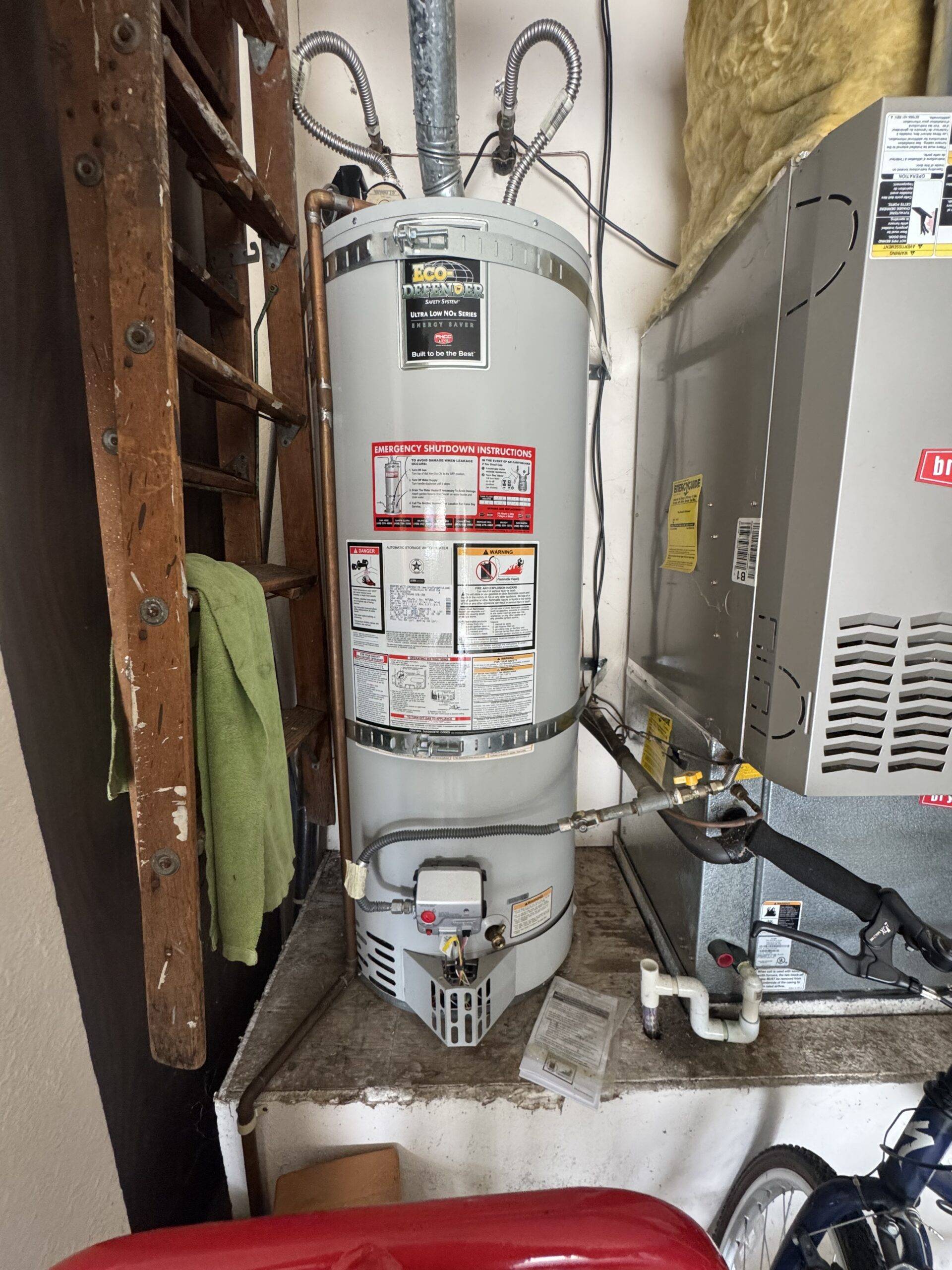 American 50 gallon water heater installed in a utility area