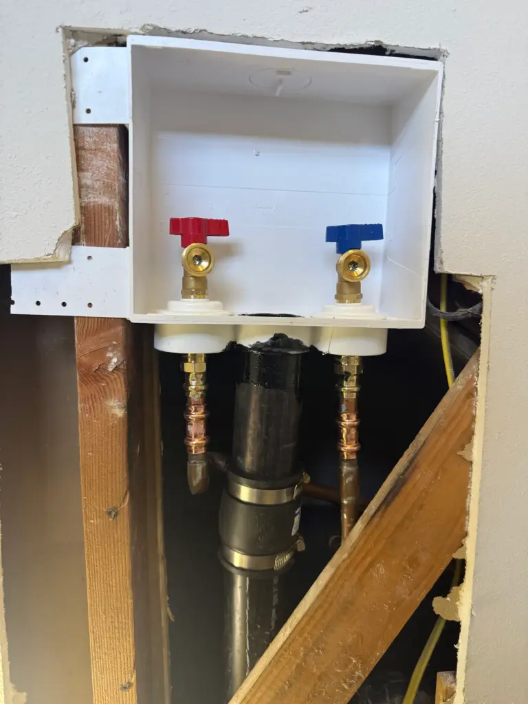Laundry outlet box replaced behind a washing machine