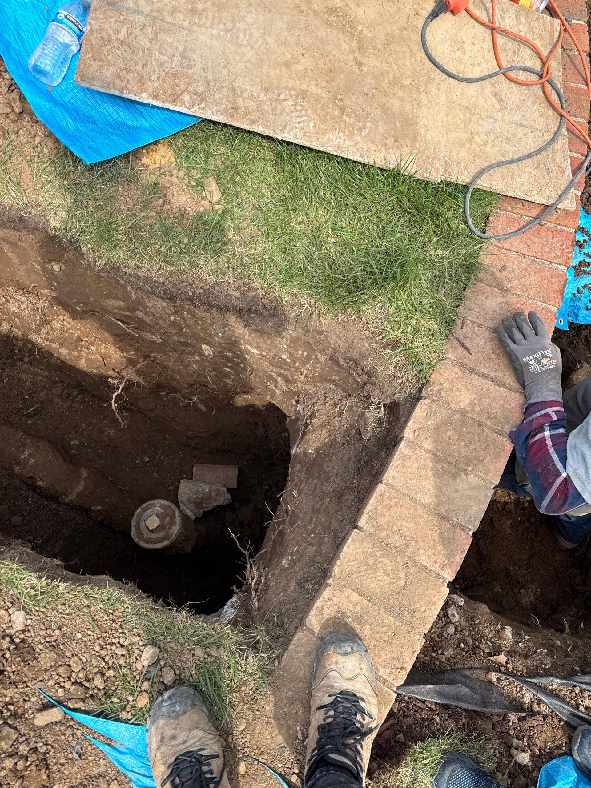Main sewer line exposed during residential plumbing work