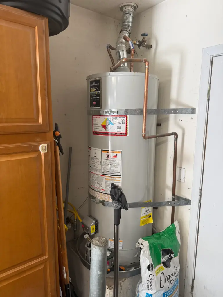 Rheem ProTerra heat pump water heater installed in a utility area