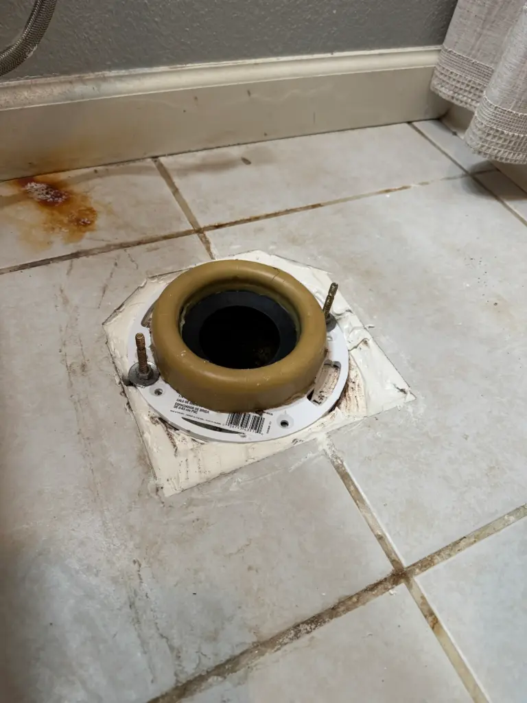 Toilet drain opening prepared for wax ring replacement