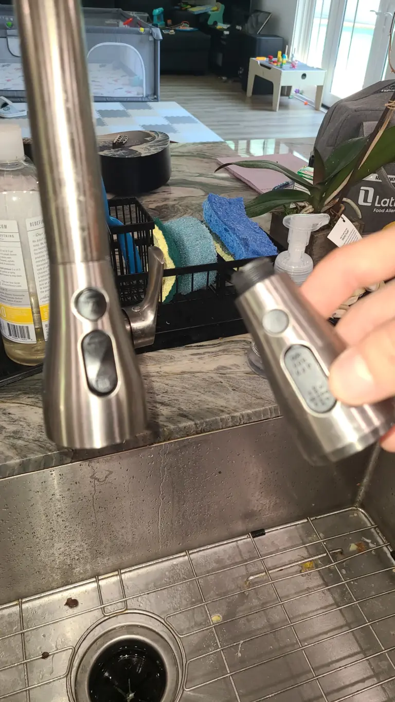 Kitchen faucet aerator being replaced