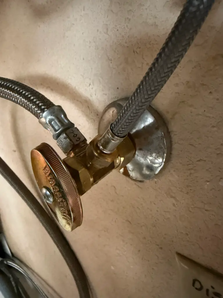 Dual angle stop valves installed beneath a sink