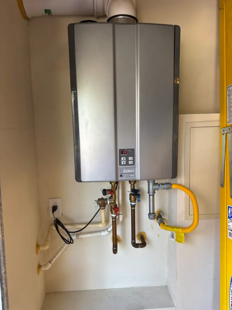Tankless water heater installed on an interior wall