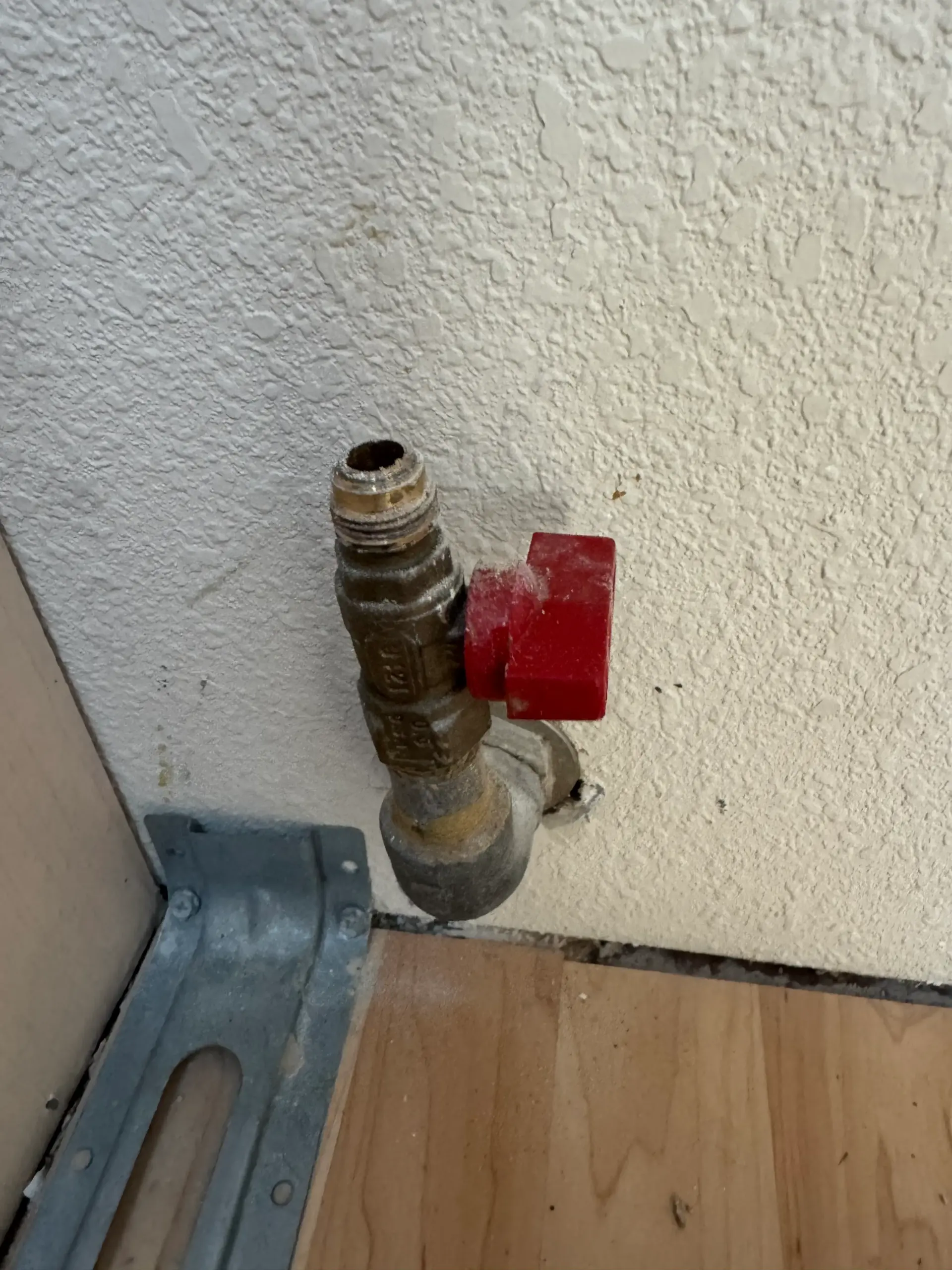 Gas line connection inspected during maintenance service