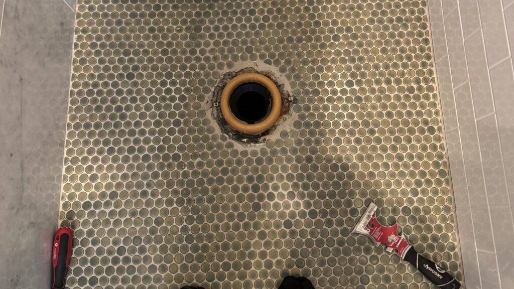 Clogged sink drain opening prepared for drain cleaning