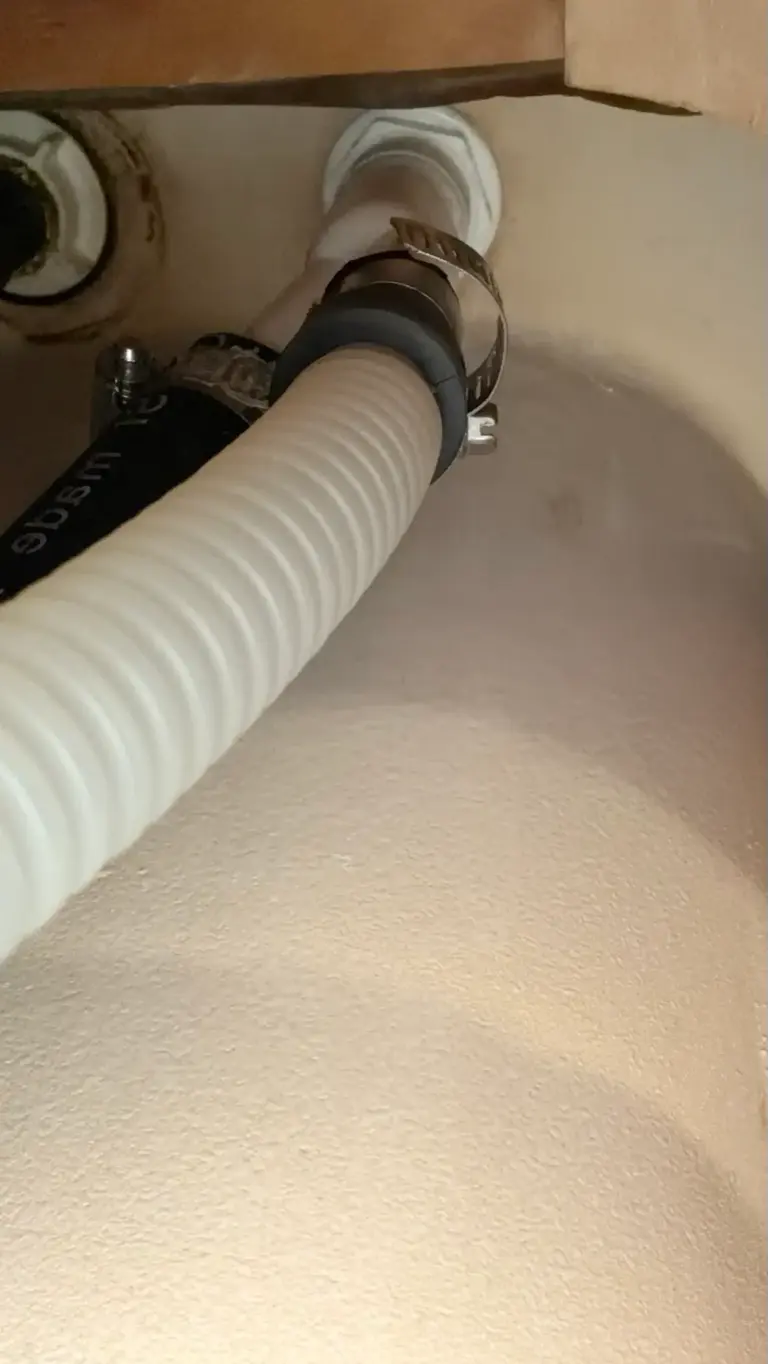 Kitchen drain line repaired beneath a sink