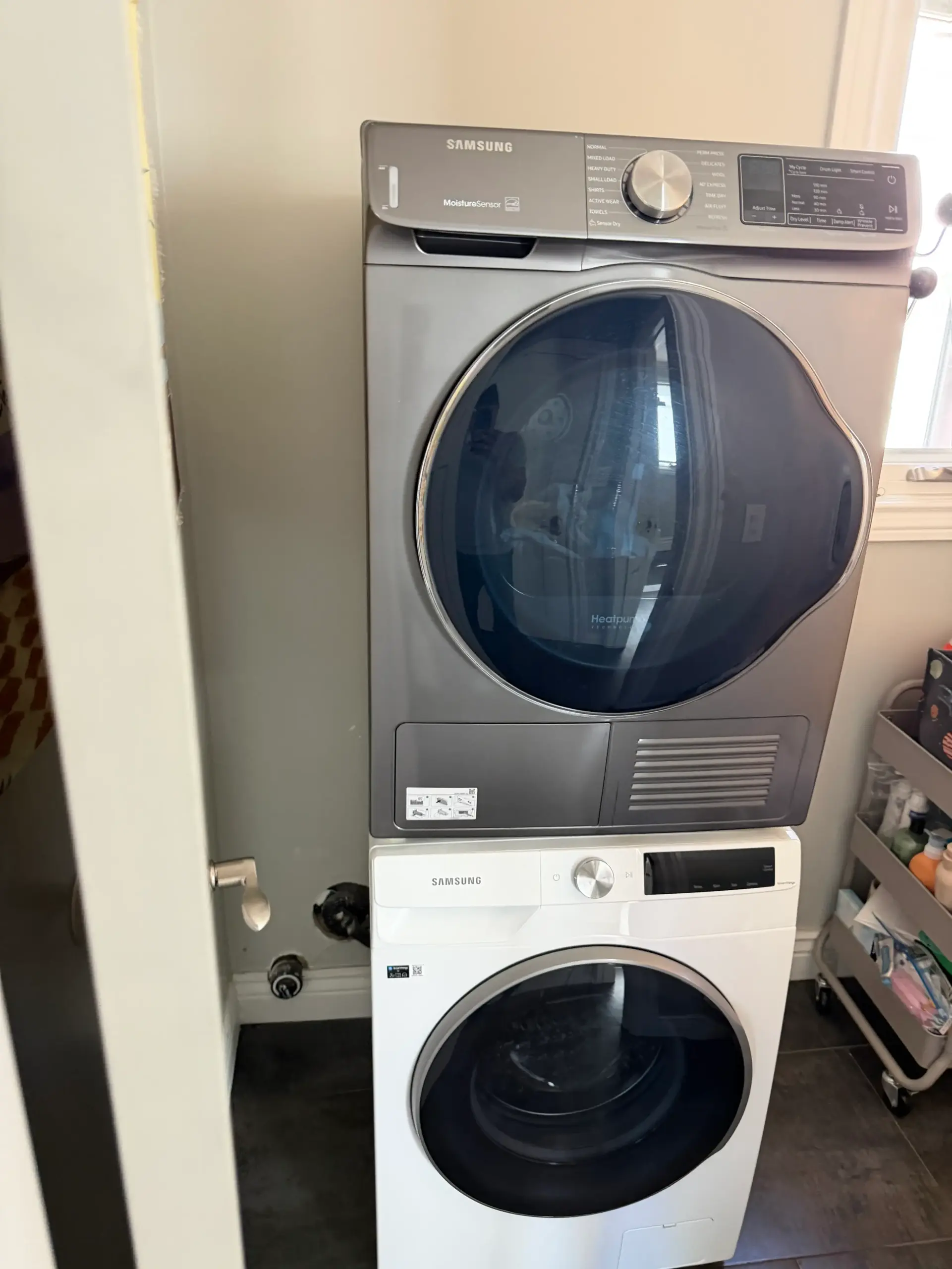 Laundry drain line servicing behind a washing machine