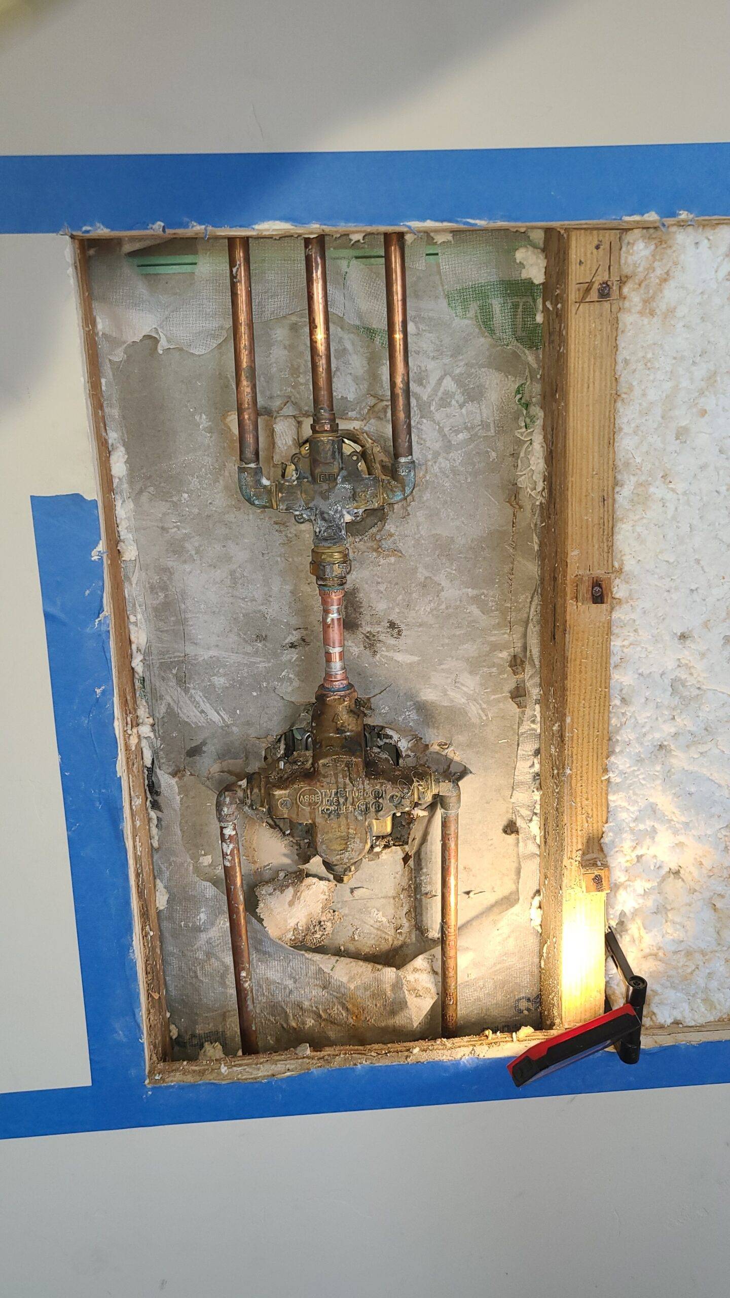 Copper water pipes exposed for partial repair