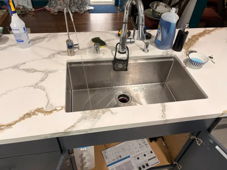 Reverse osmosis system installed beneath a kitchen sink