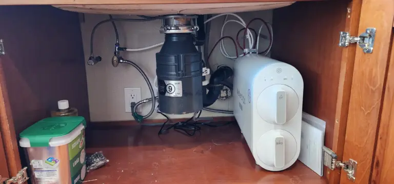 Reverse osmosis system installed beneath a kitchen sink