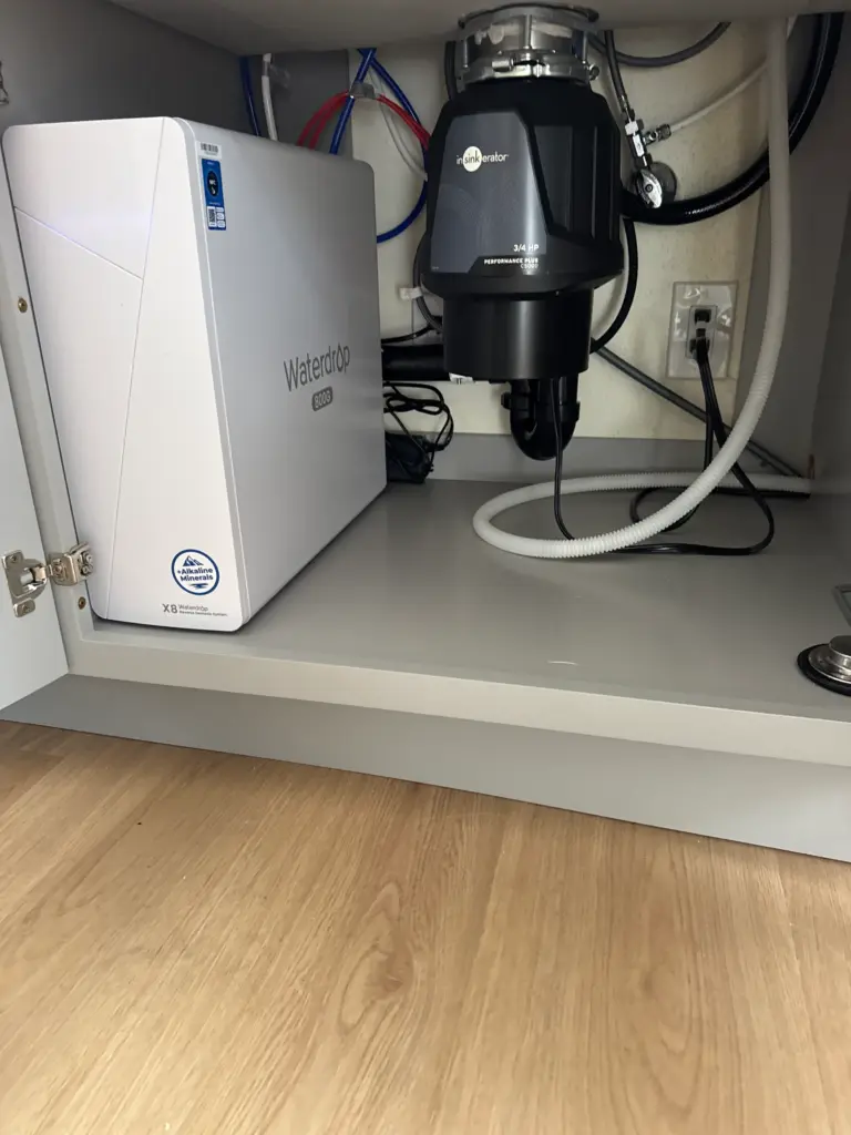 Reverse osmosis system installed beneath a kitchen sink