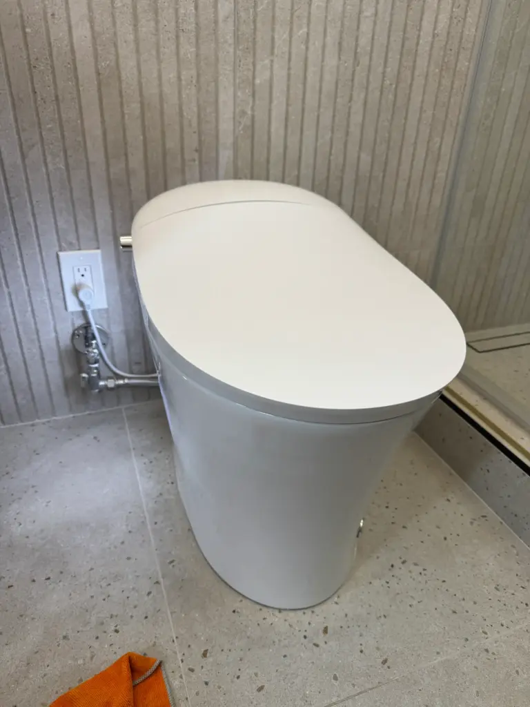 New toilet installed in a residential bathroom
