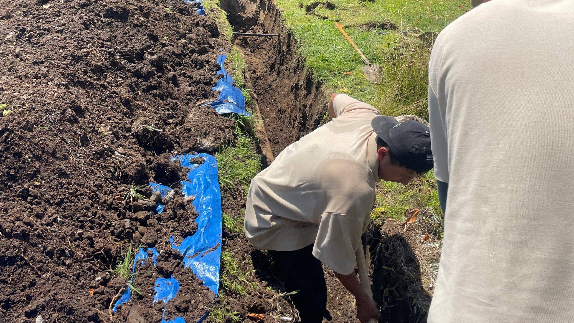 Excavated residential sewer line prepared for repair